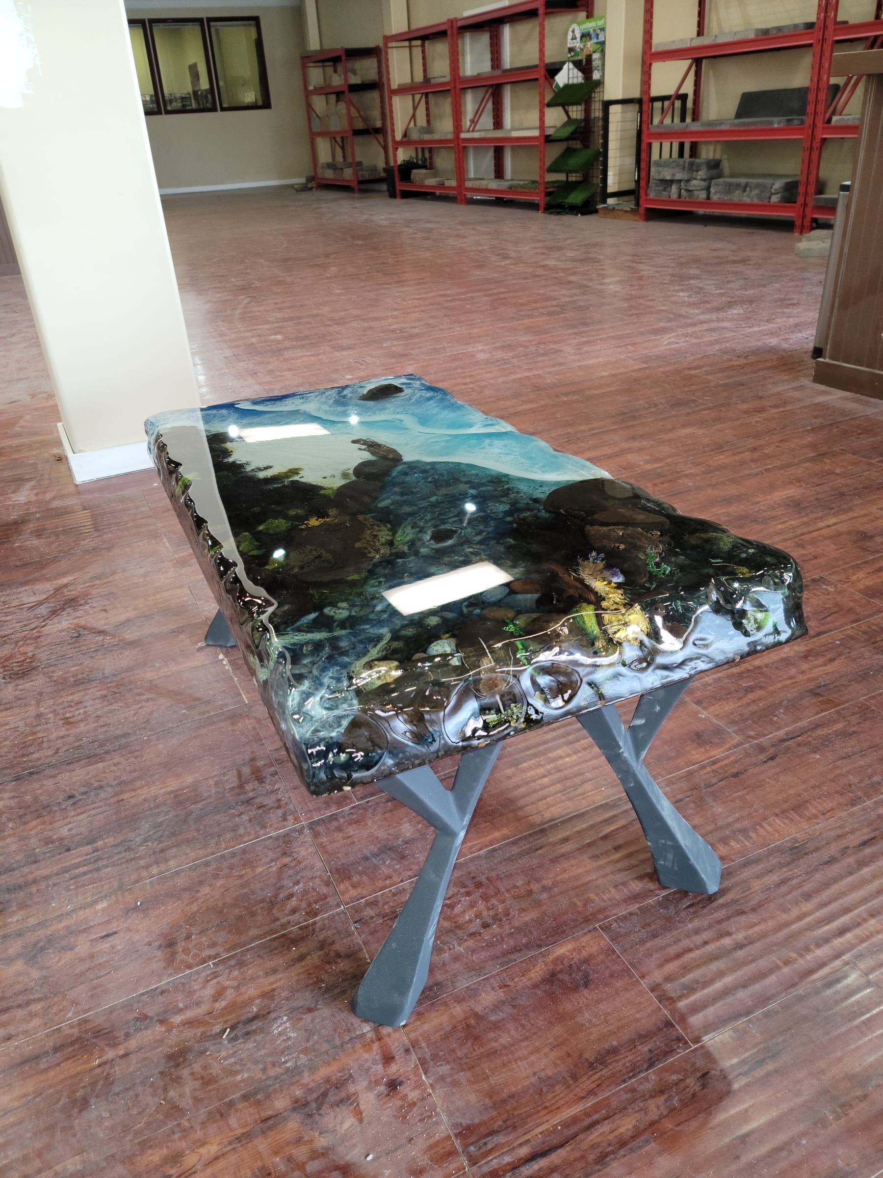 Coffee table with seafloor scene embedded in teal resin by Ray Sample, Castle Rock CO