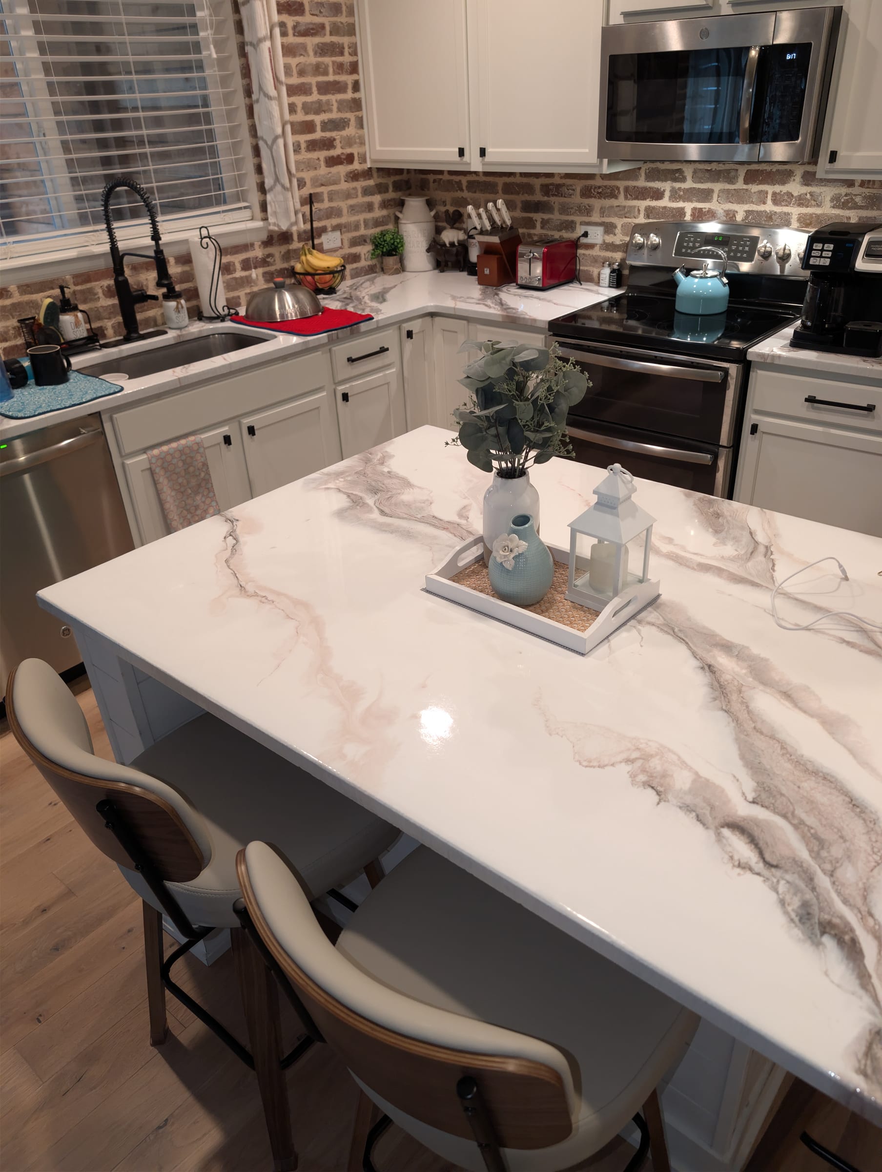 Close detail of cream marble-effect epoxy kitchen island by Ray Sample, Castle Rock CO